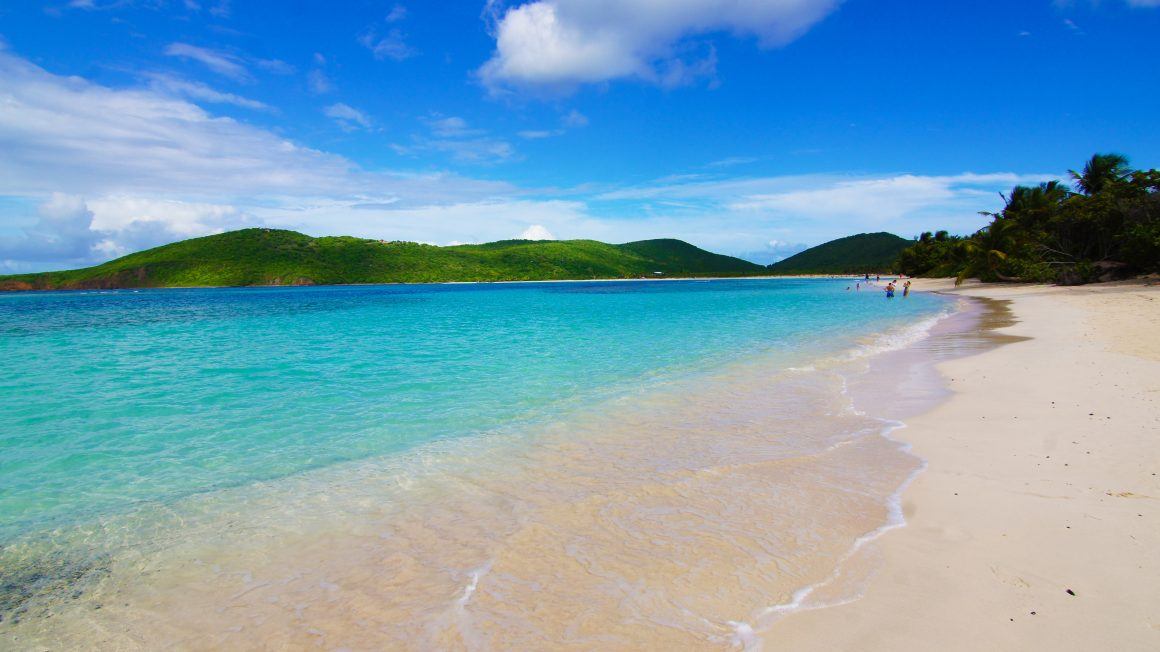 A tropical beach stretches into the distance